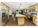 Spacious kitchen with stainless steel appliances, large island, and hardwood floors at 1393 Wayne St, Noblesville, IN 46060