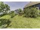 Sprawling yard with mature trees and blooming greenery at 1393 Wayne St, Noblesville, IN 46060