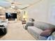 Living room featuring built-in shelving, neutral colored walls, and plush sofas at 1437 E Pleasant Run Pkwy S Dr, Indianapolis, IN 46203