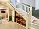 Unique staircase with built-in wooden drawers and white railings, adding character to the home at 1437 E Pleasant Run Pkwy S Dr, Indianapolis, IN 46203