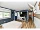 Open living room area featuring wood floors, a flat-screen TV, and comfortable seating at 1445 Biloxi Ln, Beech Grove, IN 46107