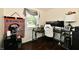 Bright home office with desk setup, comfortable seating, and unique decor like a Broncos tapestry at 1445 Biloxi Ln, Beech Grove, IN 46107