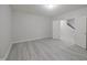 A spacious basement featuring vinyl floors, a door leading to a staircase at 15201 Slateford Rd, Noblesville, IN 46062