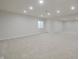 Finished basement with neutral carpet, recessed lighting, and a window at 15201 Slateford Rd, Noblesville, IN 46062