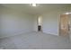 Bright bedroom with neutral carpeting and doorways leading to additional spaces and rooms at 15201 Slateford Rd, Noblesville, IN 46062