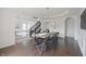 Dining room with dark wood floors and an opening into another space at 15201 Slateford Rd, Noblesville, IN 46062