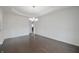 Dining room with hardwood floors, wainscoting and elegant chandelier at 15201 Slateford Rd, Noblesville, IN 46062