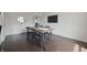 Dining room showcases a rustic wooden table and modern black chairs at 15201 Slateford Rd, Noblesville, IN 46062