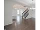 Open foyer with hardwood floors, staircase and archway at 15201 Slateford Rd, Noblesville, IN 46062