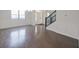 Bright foyer with hardwood floors, staircase, and natural light from large windows at 15201 Slateford Rd, Noblesville, IN 46062