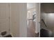 Hallway featuring hardwood floors, a staircase, and a glimpse of the front door at 15201 Slateford Rd, Noblesville, IN 46062