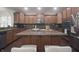 Kitchen featuring wood cabinets, granite countertops, a kitchen island, and stainless appliances at 15201 Slateford Rd, Noblesville, IN 46062