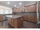 Well-appointed kitchen featuring a center island, stainless steel appliances, and granite countertops at 15201 Slateford Rd, Noblesville, IN 46062