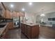 Spacious kitchen features granite countertops, stainless steel appliances, and center island at 15201 Slateford Rd, Noblesville, IN 46062