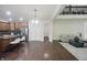 An open floor plan seamlessly connects the living room with the kitchen, featuring hardwood floors at 15201 Slateford Rd, Noblesville, IN 46062