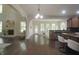 Hardwood floors seamlessly connect the living room to the kitchen and breakfast nook at 15201 Slateford Rd, Noblesville, IN 46062