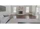 Bright living room with fireplace, hardwood floors, and ample natural light from large windows at 15201 Slateford Rd, Noblesville, IN 46062