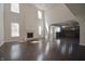Bright living room featuring a fireplace, high ceilings, and an open layout with dark hardwood floors at 15201 Slateford Rd, Noblesville, IN 46062