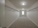 Large walk-in closet with metal shelving and carpeted floors for ample storage at 15201 Slateford Rd, Noblesville, IN 46062