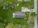 Aerial view of the house highlighting its roof, back patio, sheds, and surrounding lawn at 1535 Whalen Ave, Indianapolis, IN 46227