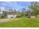 View of the backyard showing a shed, greenery, and ample space for outdoor enjoyment at 1535 Whalen Ave, Indianapolis, IN 46227