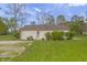 Backyard with lush green grass, sheds, and a peaceful setting, offering privacy and space at 1535 Whalen Ave, Indianapolis, IN 46227