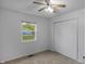 Bedroom featuring neutral carpet, ceiling fan, closet, and window allowing natural light to fill the space at 1535 Whalen Ave, Indianapolis, IN 46227