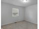 Bedroom with neutral carpet and a window, offering a blank canvas for personalization at 1535 Whalen Ave, Indianapolis, IN 46227