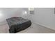 Bedroom featuring carpet, a bed with a black cover, natural light, and simple decor at 1535 Whalen Ave, Indianapolis, IN 46227