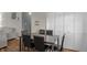 Dining area featuring a modern table, stylish chairs, and convenient closet space at 1535 Whalen Ave, Indianapolis, IN 46227