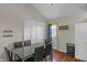Dining room with a modern table and natural light from the door and windows at 1535 Whalen Ave, Indianapolis, IN 46227