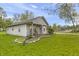 This home has a welcoming front porch with chairs and a yard, perfect for relaxing and outdoor enjoyment at 1535 Whalen Ave, Indianapolis, IN 46227