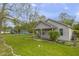Charming home featuring a cozy front porch and well-maintained lawn surrounded by mature trees at 1535 Whalen Ave, Indianapolis, IN 46227