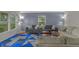 Bright living room featuring stylish sofas, and a modern blue and grey rug at 1535 Whalen Ave, Indianapolis, IN 46227