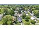 Aerial view of a home with a large lawn, mature trees, and neighborhood at 1539 Evans Ave, Noblesville, IN 46060