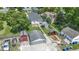 Spacious property features a two-car garage, a red shed, and a large yard with mature trees at 1539 Evans Ave, Noblesville, IN 46060