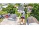 Aerial perspective highlighting the backyard with sheds and the detached garage of this property at 1539 Evans Ave, Noblesville, IN 46060