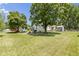 Expansive backyard featuring mature trees and a charming shed, perfect for outdoor enjoyment at 1539 Evans Ave, Noblesville, IN 46060