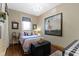 This bedroom has a decorative chandelier and a painting hung on the wall at 1539 Evans Ave, Noblesville, IN 46060
