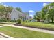 Charming two-story home with well-maintained lawn and mature landscaping at 1539 Evans Ave, Noblesville, IN 46060