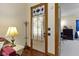 Entryway with hardwood floors featuring vintage decorations and views into the living room at 1539 Evans Ave, Noblesville, IN 46060