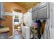 The functional laundry area includes a stacked washer and dryer, cabinets, and ample storage at 1539 Evans Ave, Noblesville, IN 46060