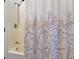 Bright and clean shower area featuring patterned curtain and neutral walls at 1539 Evans Ave, Noblesville, IN 46060