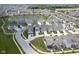 Aerial view of a beautiful suburban community with well-manicured lawns and a tranquil pond at 15557 Starflower Dr, Westfield, IN 46074