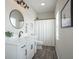 Stylish bathroom with a vanity, framed mirror, sleek lighting, and a shower with a white curtain at 15557 Starflower Dr, Westfield, IN 46074