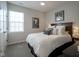 Cozy bedroom featuring a comfortable bed, stylish decor, ceiling fan and plenty of natural light at 15557 Starflower Dr, Westfield, IN 46074