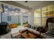 Inviting covered patio with stylish furniture, outdoor lighting and ceiling fan at 15557 Starflower Dr, Westfield, IN 46074