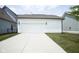 Detached two-car garage with ample parking space and modern exterior lighting at 15557 Starflower Dr, Westfield, IN 46074