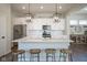 Bright, modern kitchen with a spacious island and stainless steel appliances at 15557 Starflower Dr, Westfield, IN 46074
