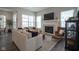 Inviting living room featuring a fireplace, comfortable seating, and natural light at 15557 Starflower Dr, Westfield, IN 46074